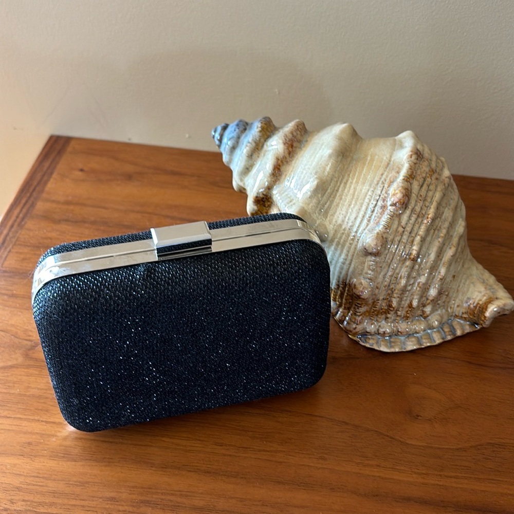 Jessica McClintock black clutch with a shimmer sparkling look.